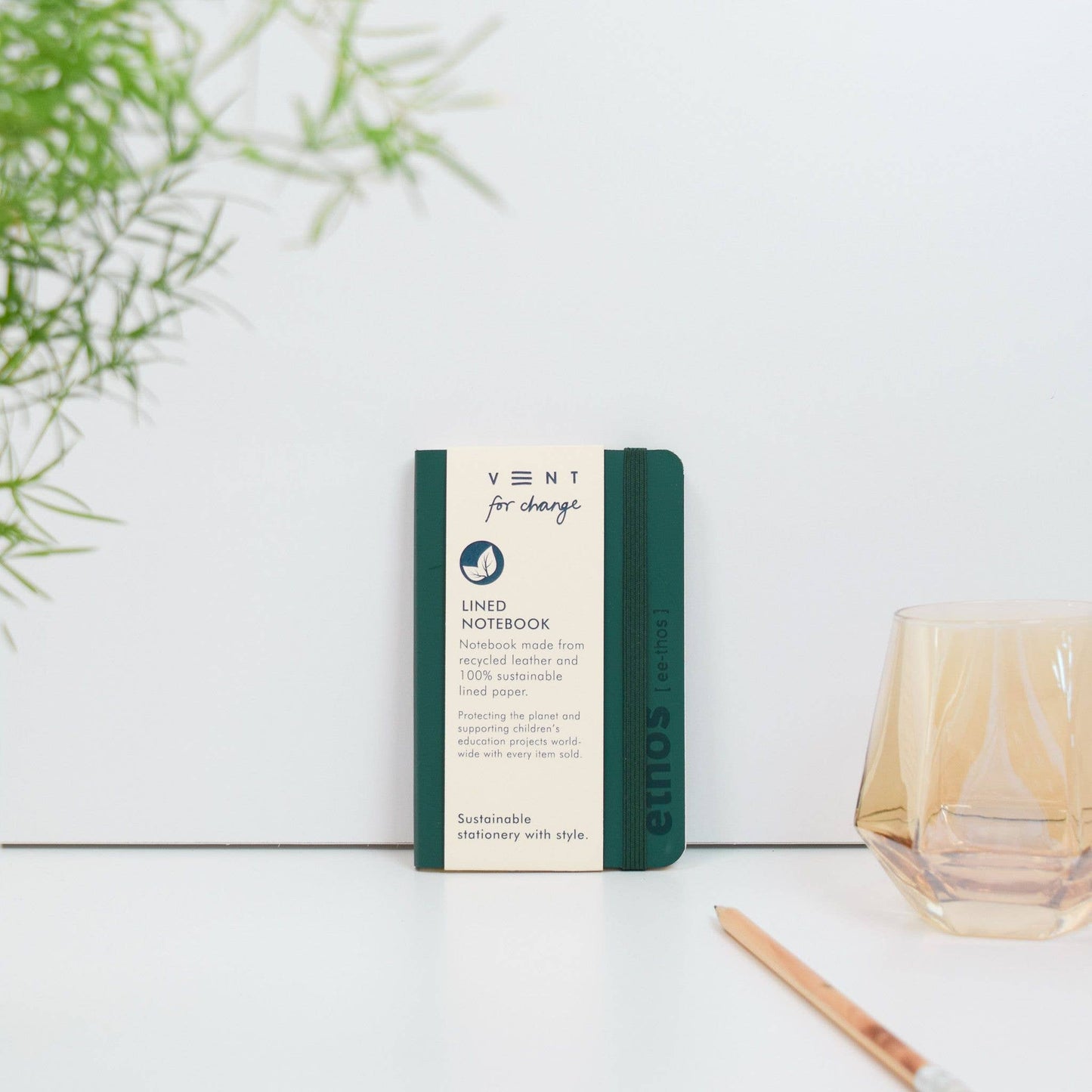 A6 recycled leather pocket notebook with elastic closure in green