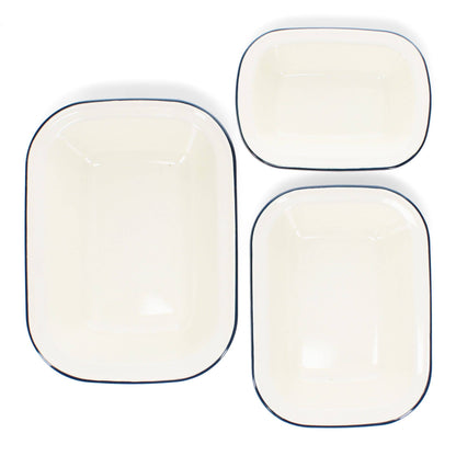 Set of three white enamel pie dishes with blue rim in assorted sizes