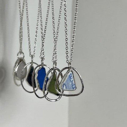 Sterling silver sea glass and pottery pendant necklaces handmade in Dundee with teardrop or circle design