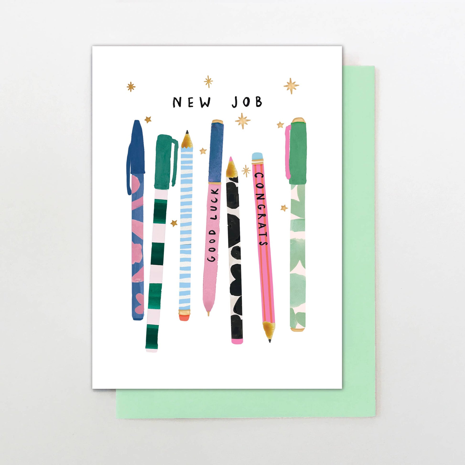 New job card with pen illustrations, green envelope, gold foil, “Good Luck” and “Congrats” pens