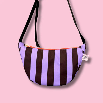 Handprinted sling bag handmade in Dundee from water-resistant wax cotton with padded lining, inner pocket and adjustable strap.