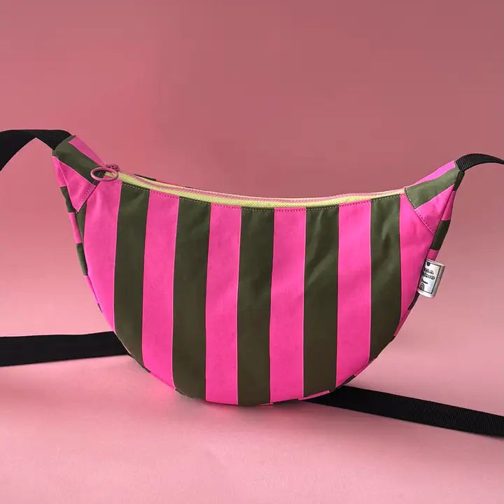 Handprinted sling bag handmade in Dundee from water-resistant wax cotton with padded lining, inner pocket and adjustable strap.