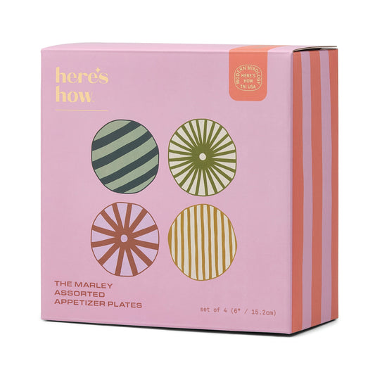 Set of four Marley appetizer plates with bold geometric patterns and vibrant colours, perfect for serving small bites and entertaining in style.