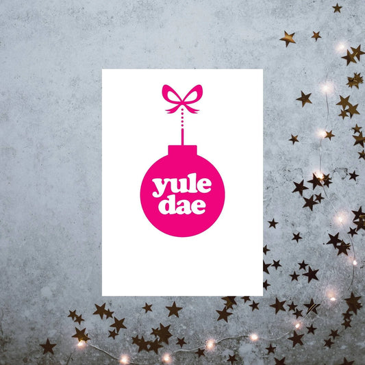 A vertically folded greeting card with the Scottish Christmas phrase "Yule Dae" in a hand-designed typography style.