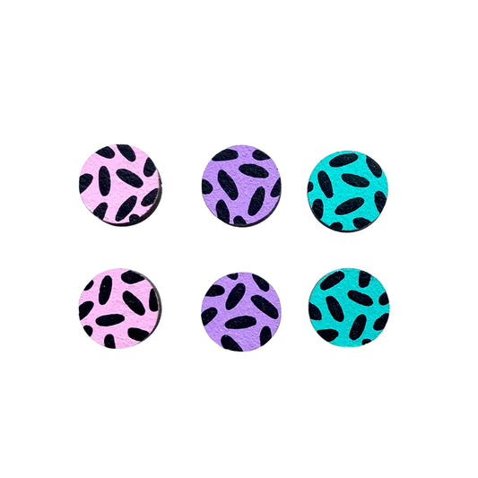A set of three Ivy and Ginger pastel dash mini stud earrings with silver surgical stainless steel posts and butterfly fastenings, each with a different colour pattern.