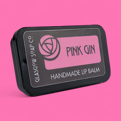 Handmade Pink Gin-flavoured lip balm with coconut oil, shea butter & beeswax. Rich, nourishing, and a cheeky Scottish treat. 15g slide tin.